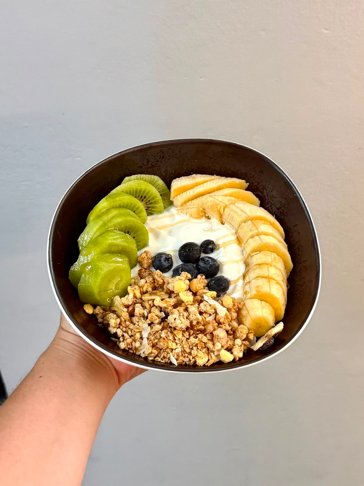 Yogurt bowl with fruit and granola at La Despensa café